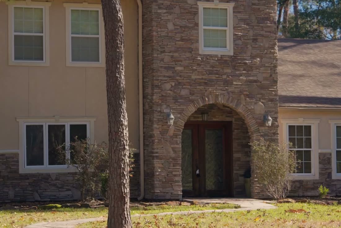 Brick two-story home exterior in Kingwood